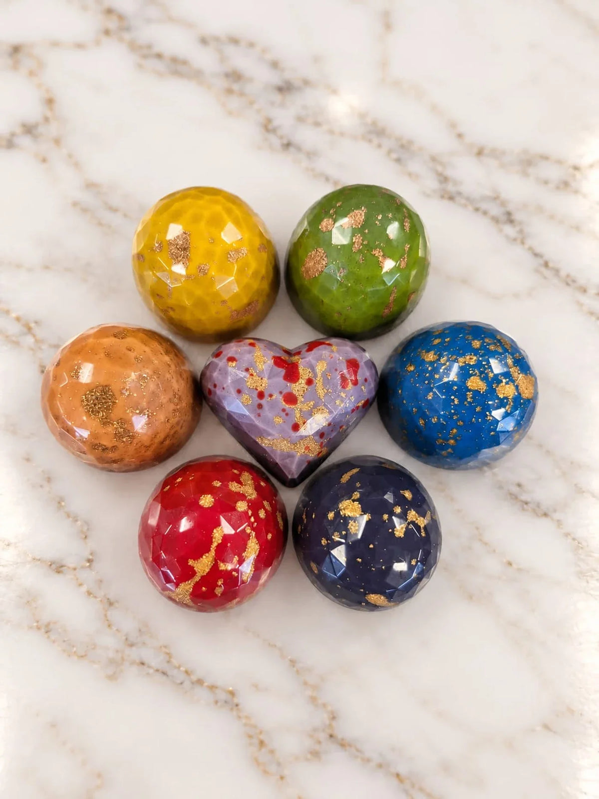 De zeven AURA11 Bonbons rond het Hart
